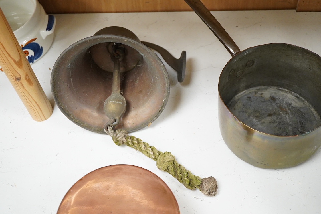 A bronze bell dated 1839 and two Victorian copper and brass saucepans
